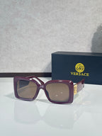 Square Versace sunglasses, plum-purple frame with taupe lenses.