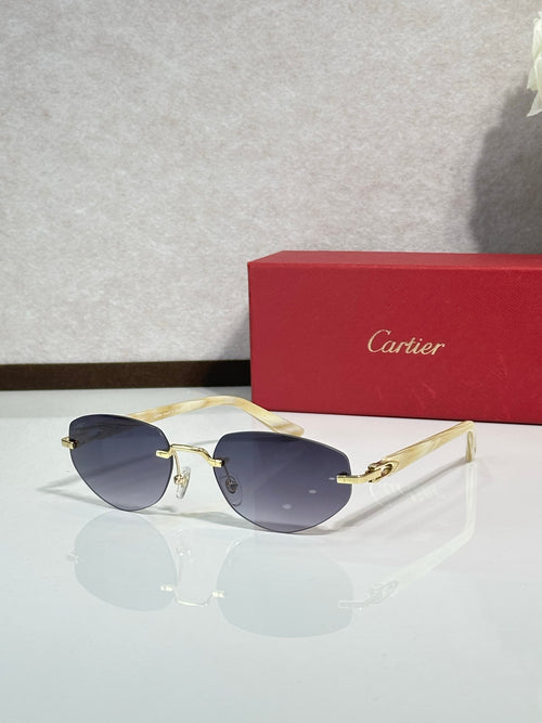 Cartier sunglasses, gold-tone frame with dark navy lenses and clear side arms
