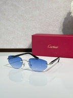 Cartier sunglasses with blue-tinted lenses and gold-tone frame with dark temples