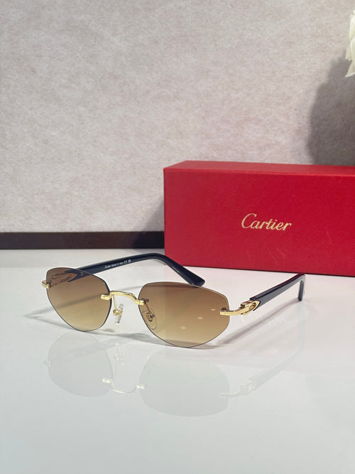 Cartier sunglasses, gold-tone frame with blue arms and amber-tinted lenses