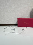 Eyeglasses with clear frame and gold-tone detailing, wire temples with rectangular lenses
