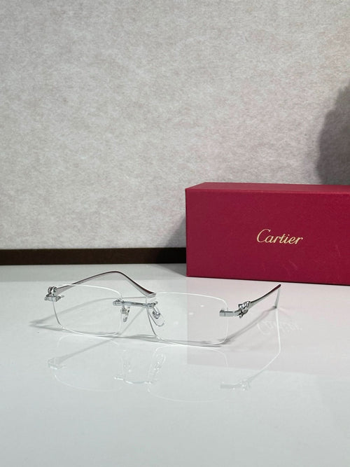 Eyeglasses with clear frame and gold-tone detailing, wire temples with rectangular lenses