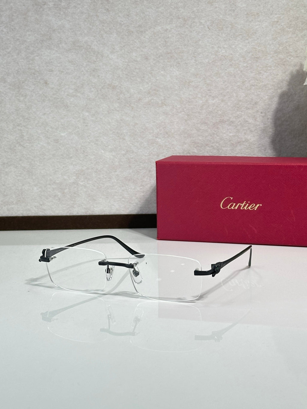 Eyeglasses with clear frame and gold-tone accents, front view with rectangular lens shape