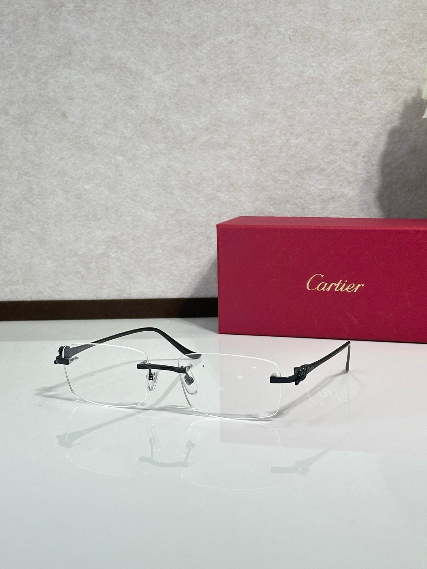 Eyeglasses with clear frame and gold-tone accents, front view with rectangular lens shape