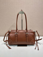 Prada brown leather tote bag with two top handles and side drawstring ties