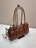 Prada brown leather tote bag, side view with detachable strap and silver hardware