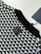 Houndstooth crewneck sweater neckline detail, black rib trim with Louis Vuitton logo tag