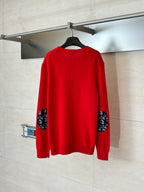 Red knit long-sleeve sweater, back view with ribbed hem and cuffs