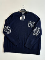 Navy knit sweater with logo graphic patch at chest and sleeves