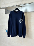 Navy long-sleeve knit sweater with graphic logo pocket at chest