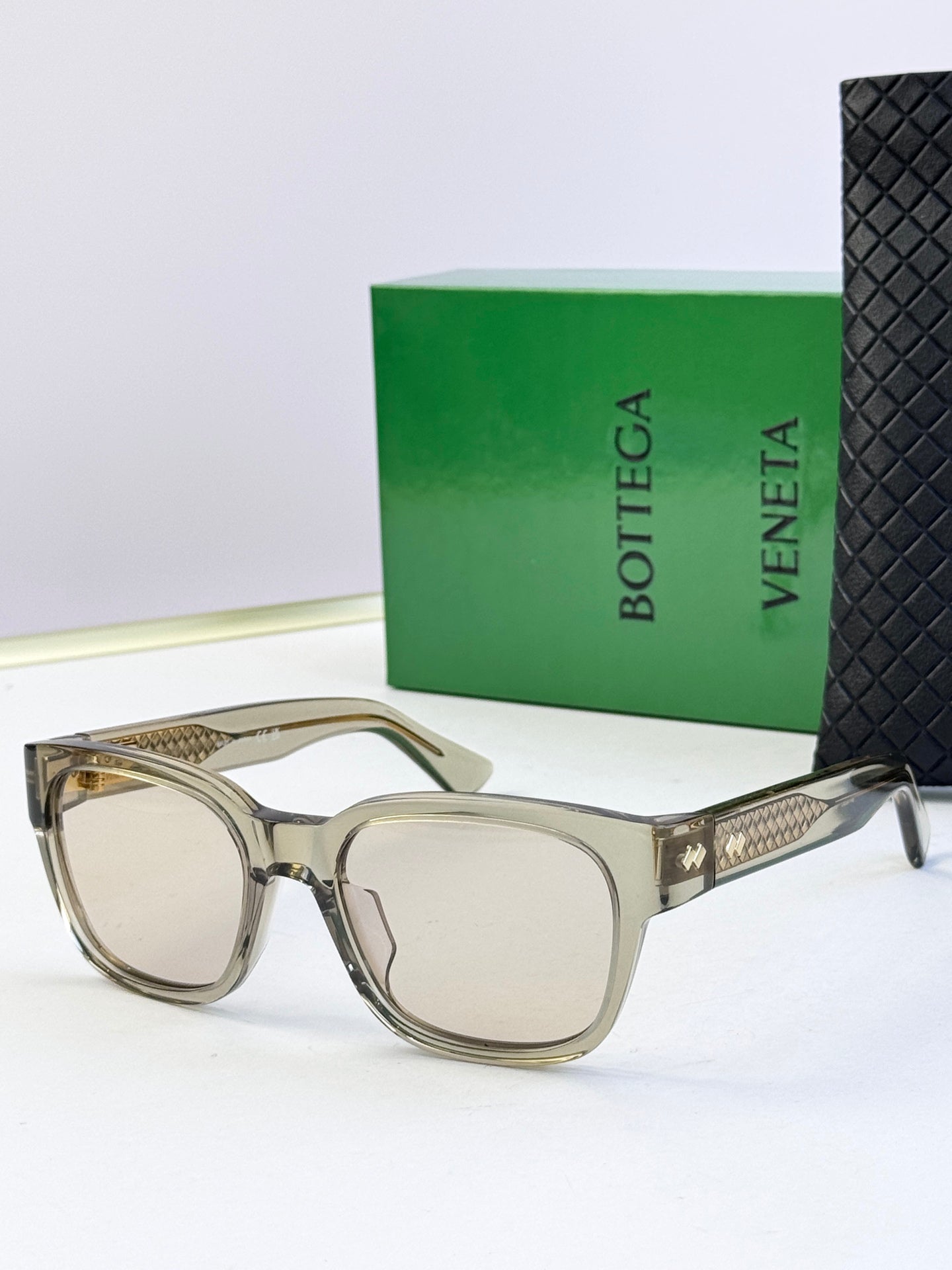 Bottega Veneta sunglasses with clear light frame and light lenses
