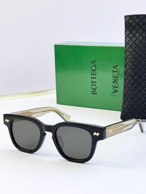 Bottega Veneta sunglasses, black frame with textured gold temple and dark lenses