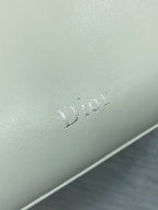 Dior logo embossing on light ivory leather bag