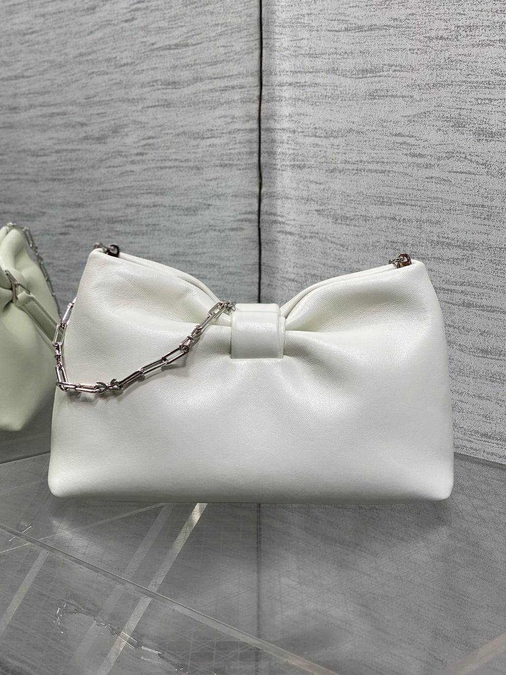 Ivory leather Dior bow handbag with chain shoulder strap and knot front