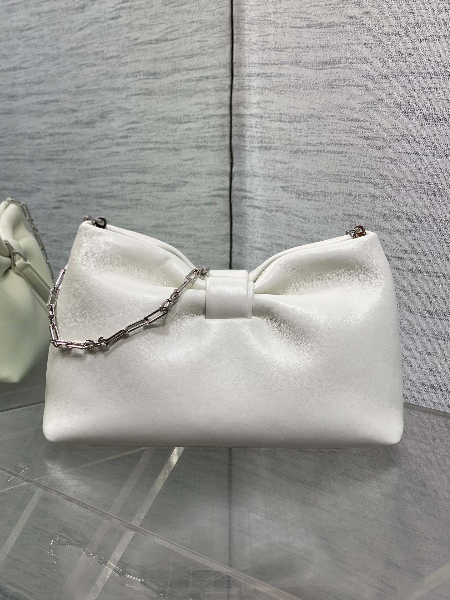 Ivory leather Dior bow handbag with chain shoulder strap and knot front