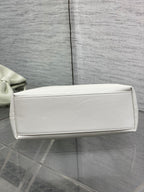 Ivory leather Dior handbag with flat base and stitched panel