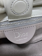 Ivory leather Dior handbag zipper pull with 'Dior' logo patch