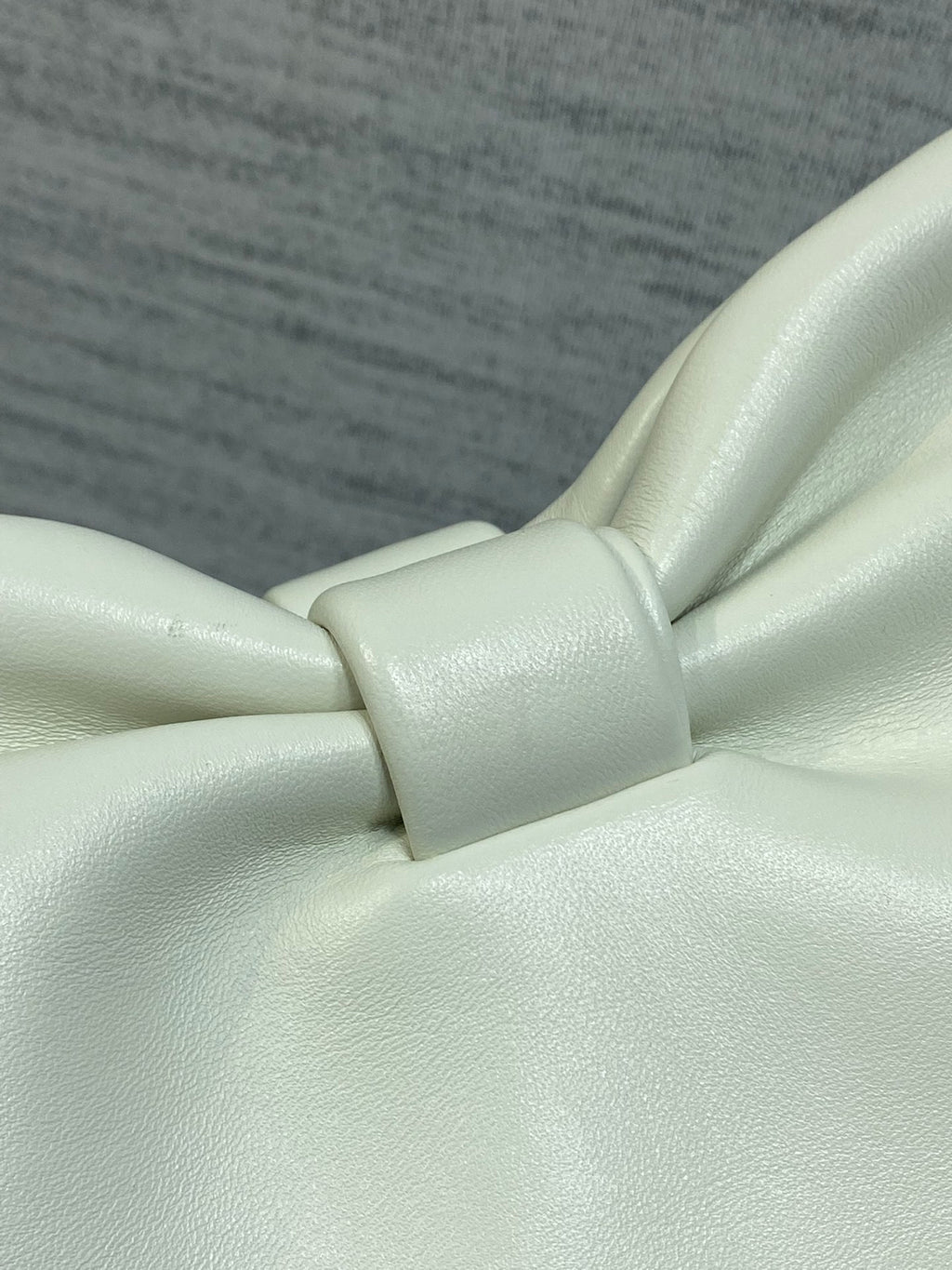 Ivory leather bow detail on a Dior handbag