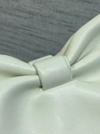 Ivory leather bow detail on a Dior handbag