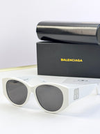 White acetate sunglasses with round lenses and gold 8B logo on temple