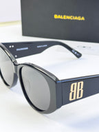 Blue acetate sunglasses with round lenses and gold 8B logo on temple