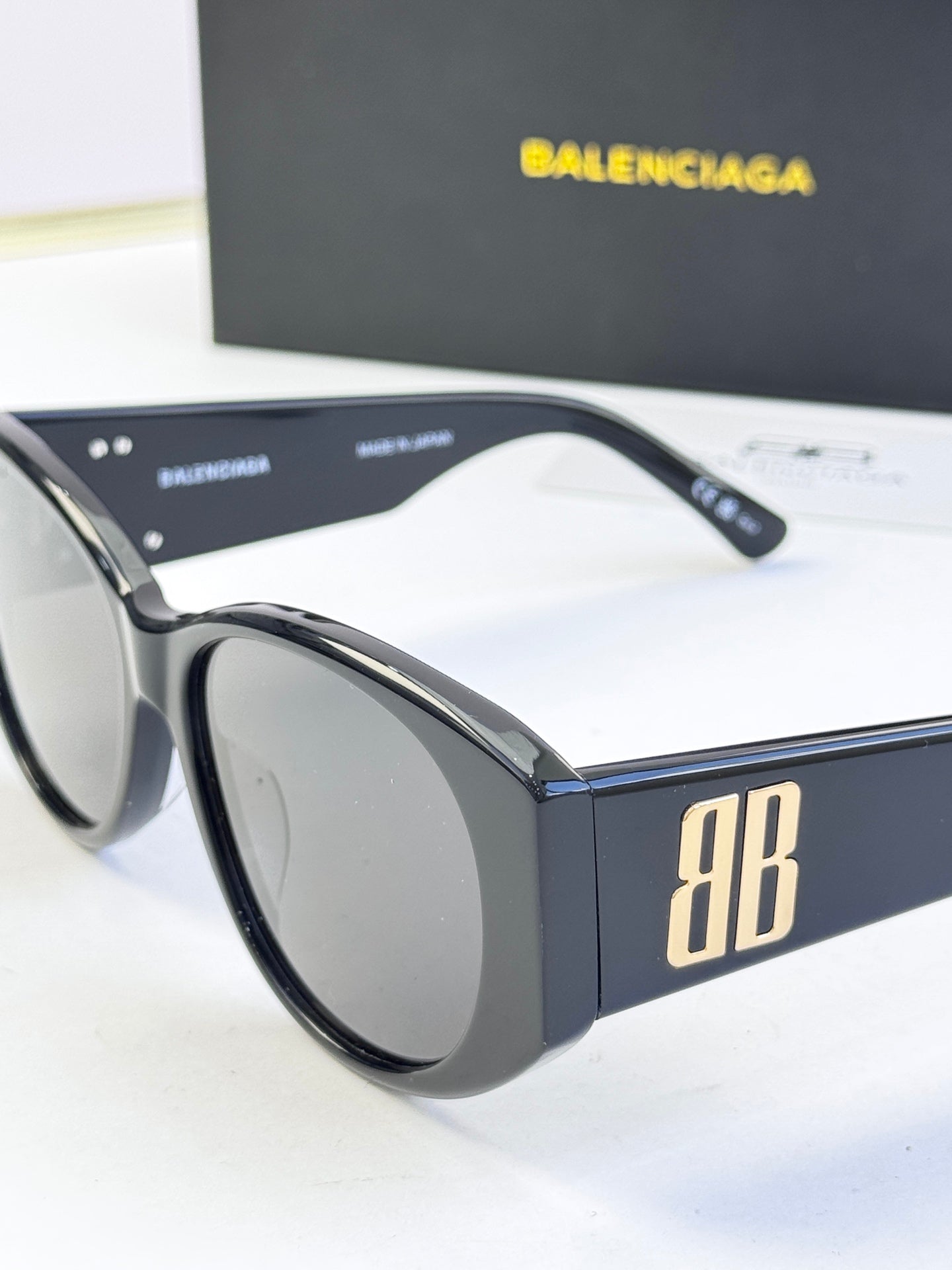 Blue acetate sunglasses with round lenses and gold 8B logo on temple
