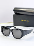 Black acetate sunglasses with round lenses and gold 8B logo at temple