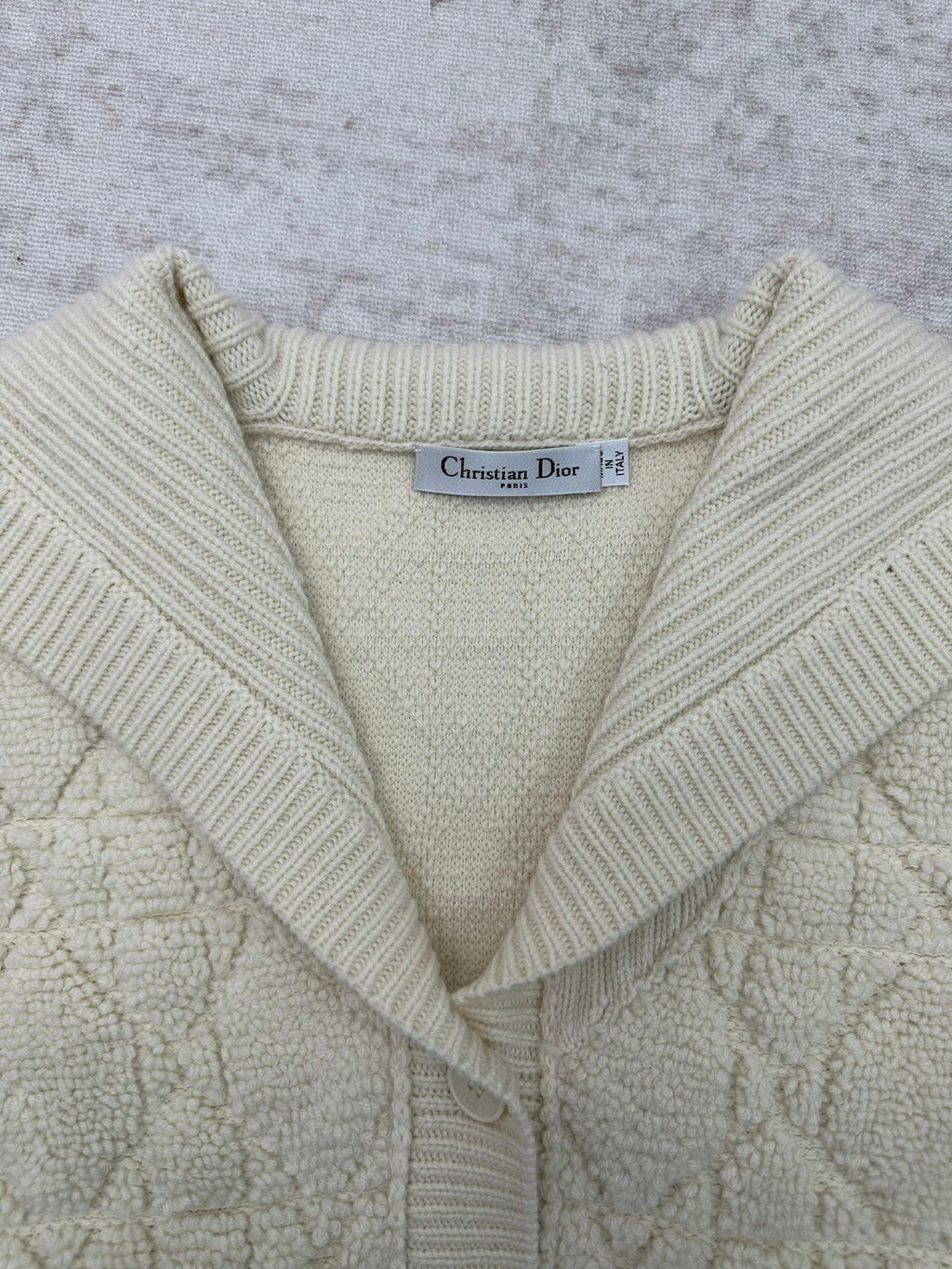 Cream knit Dior hooded jacket neckline with V-slit and ribbed hood edges