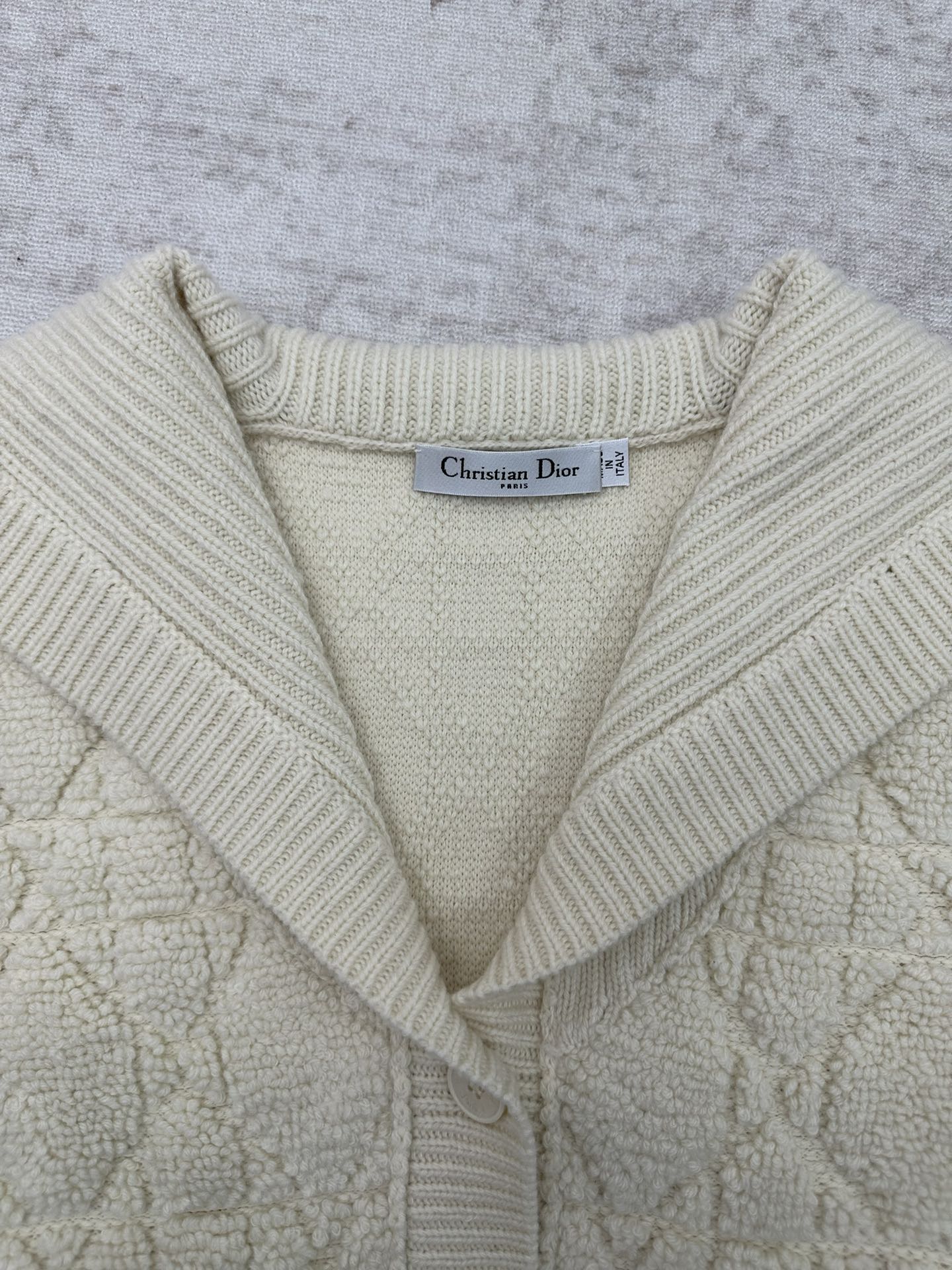 Cream knit Dior hooded jacket neckline with V-slit and ribbed hood edges