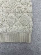 Cream knit Dior jacket bottom hem with ribbed band and textured fabric panel