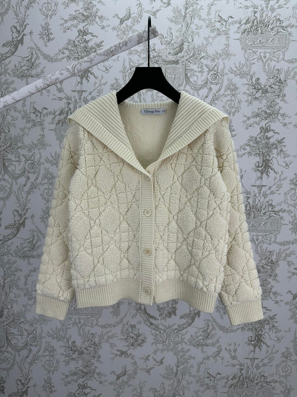 Cream knit Dior hooded jacket with quilted diamond texture and ribbed hem cuffs