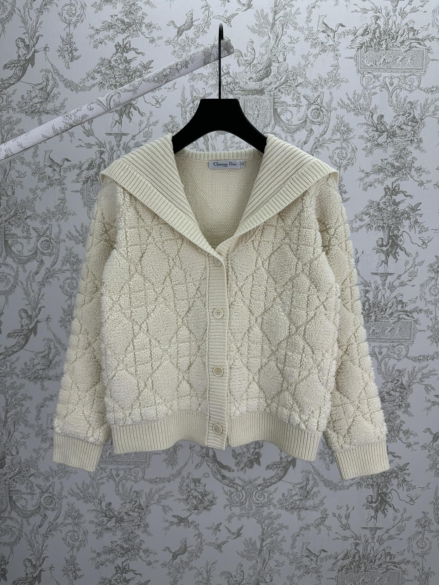 Cream knit Dior hooded jacket with quilted diamond texture and ribbed hem cuffs