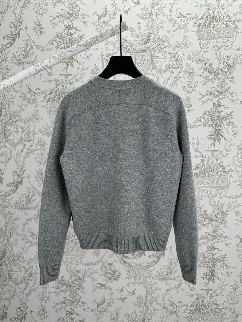 Gucci gray knit cardigan back view with ribbed trim at neck, cuffs, and hem