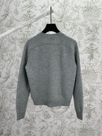 Gucci gray knit cardigan back view with ribbed trim at neck, cuffs, and hem