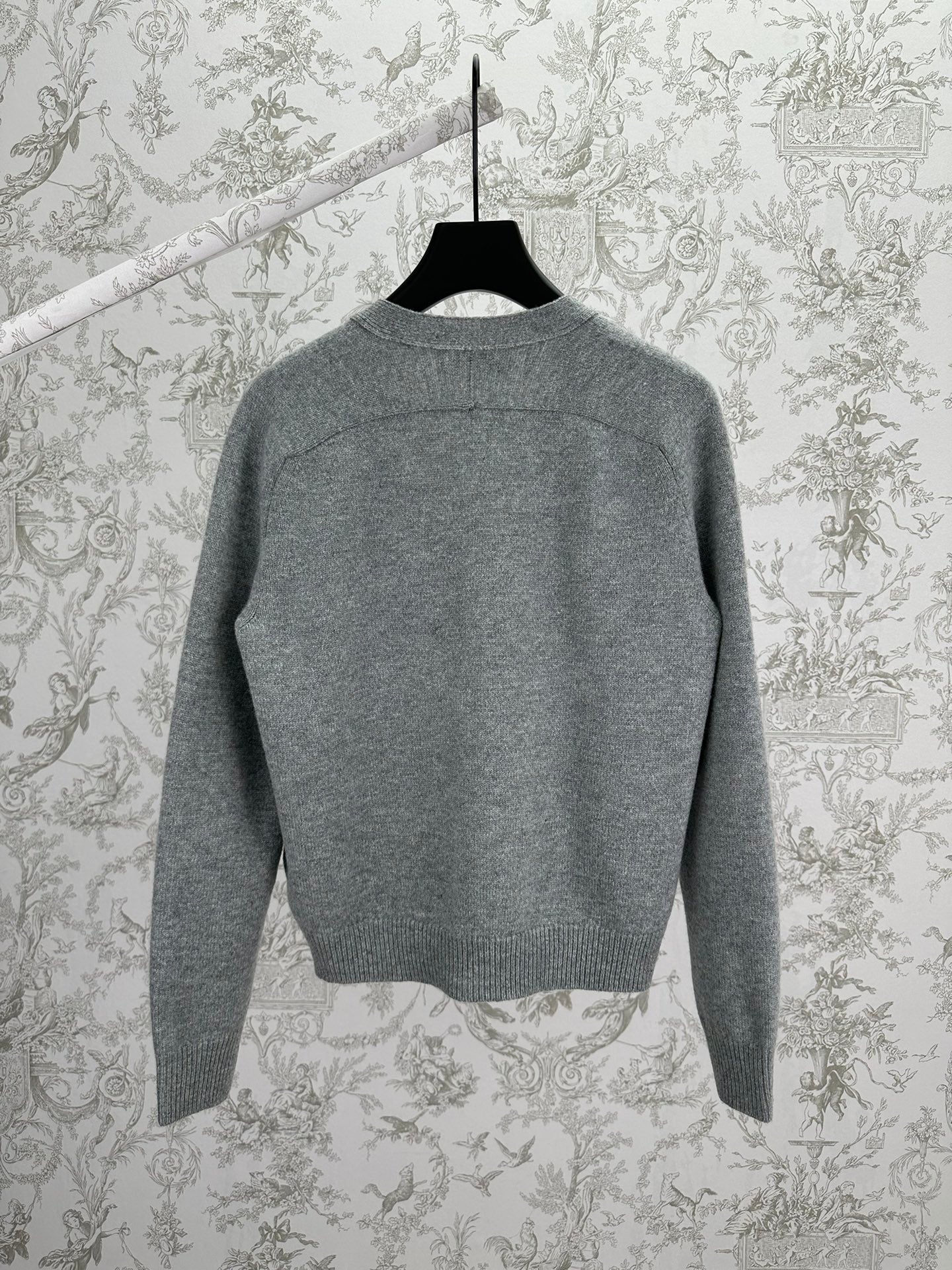Gucci gray knit cardigan back view with ribbed trim at neck, cuffs, and hem