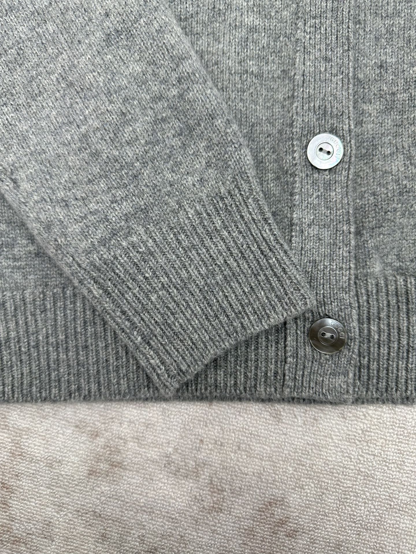 Gucci gray knit cardigan cuff and button detail with ribbed sleeve hem