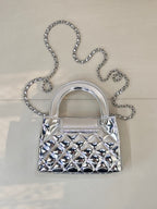 Chanel silver quilted mini bag front view with chain shoulder strap and curved handles