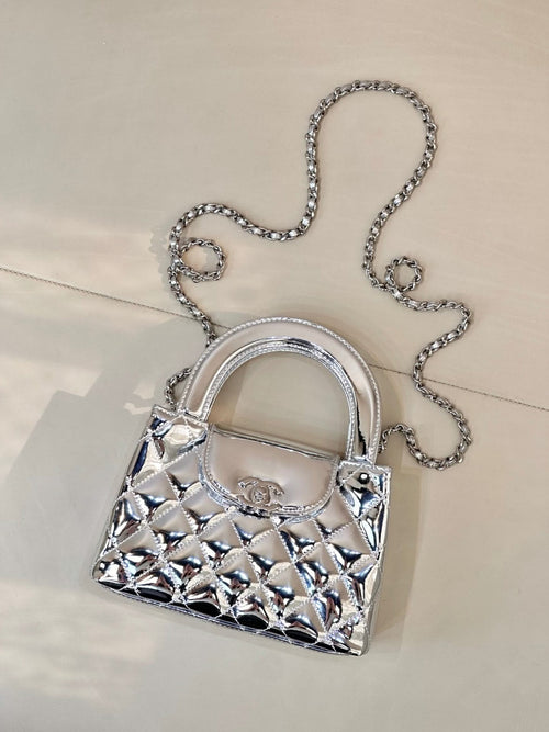 Chanel silver quilted mini bag, front view, top handle and chain strap