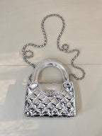 Chanel silver quilted mini bag with top handle and chain shoulder strap