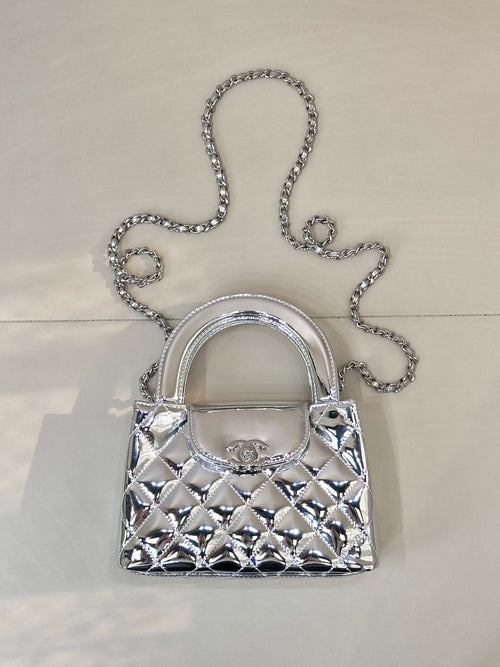 Chanel silver quilted mini bag with top handle and chain shoulder strap