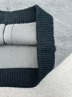 Balenciaga knit zip hoodie close-up with ribbed cuff and dark navy hood trim