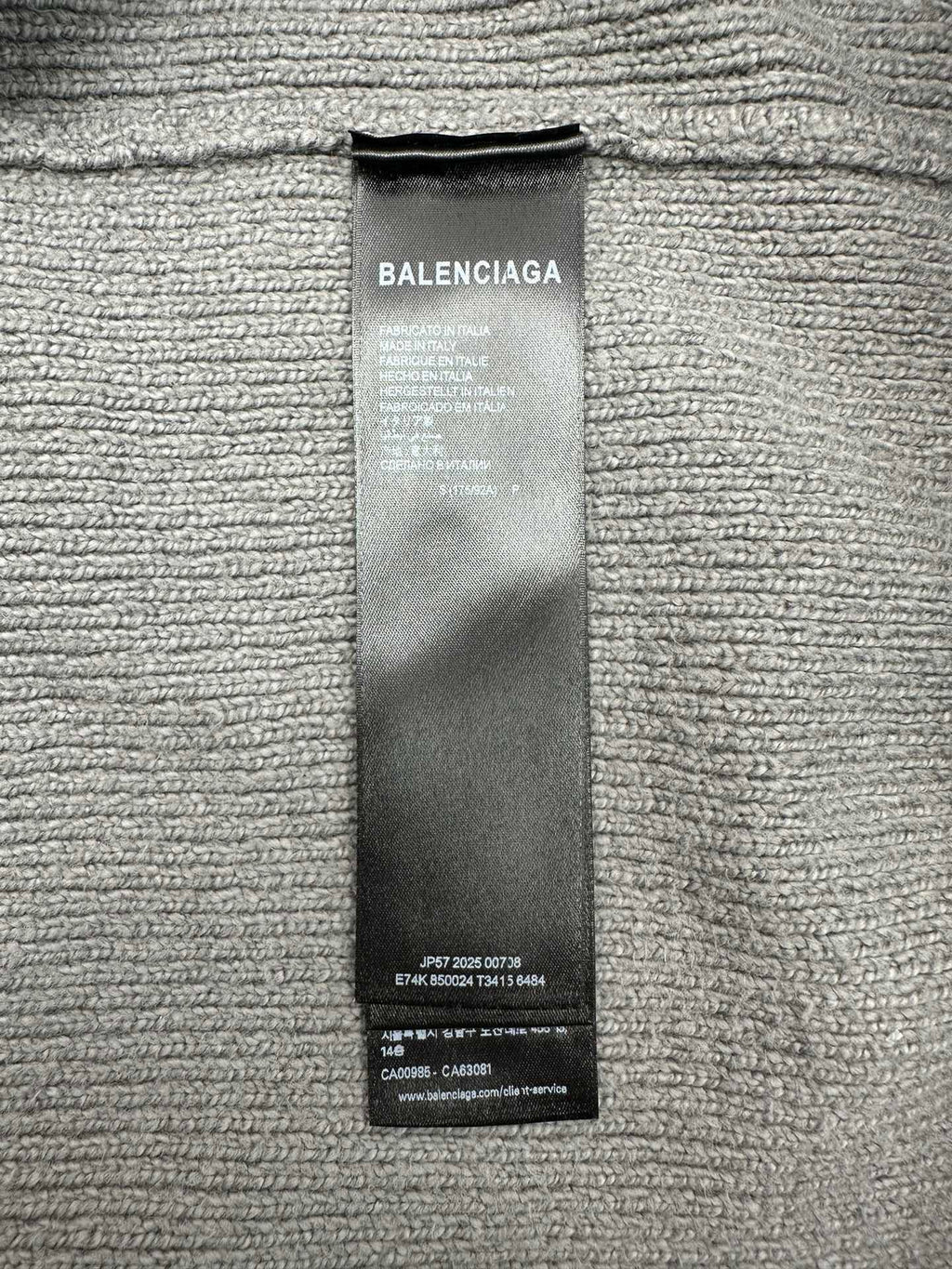 Balenciaga fabric care label tag on knit hoodie