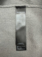 Balenciaga fabric care label tag on knit hoodie