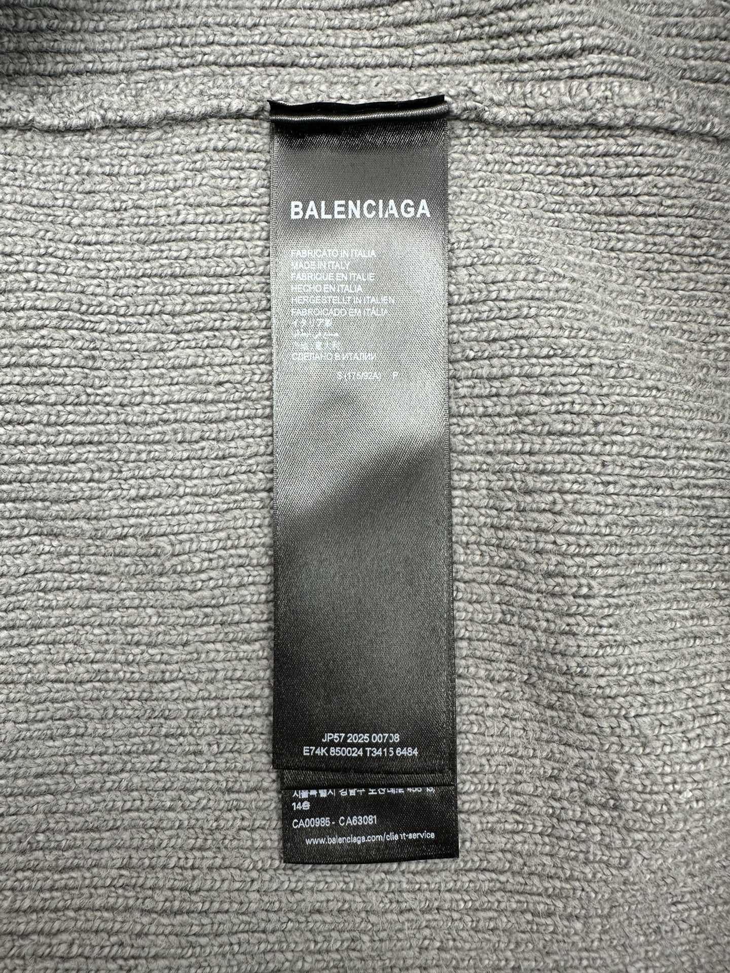 Balenciaga fabric care label tag on knit hoodie
