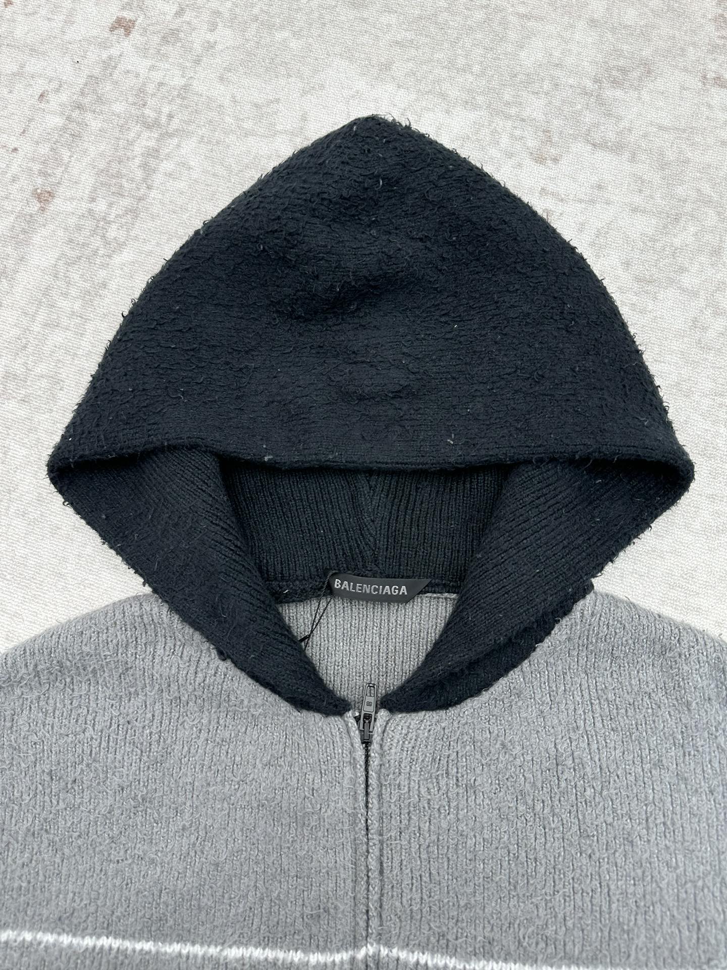 Balenciaga hooded knit zip sweater in dark navy with visible interior hood seam