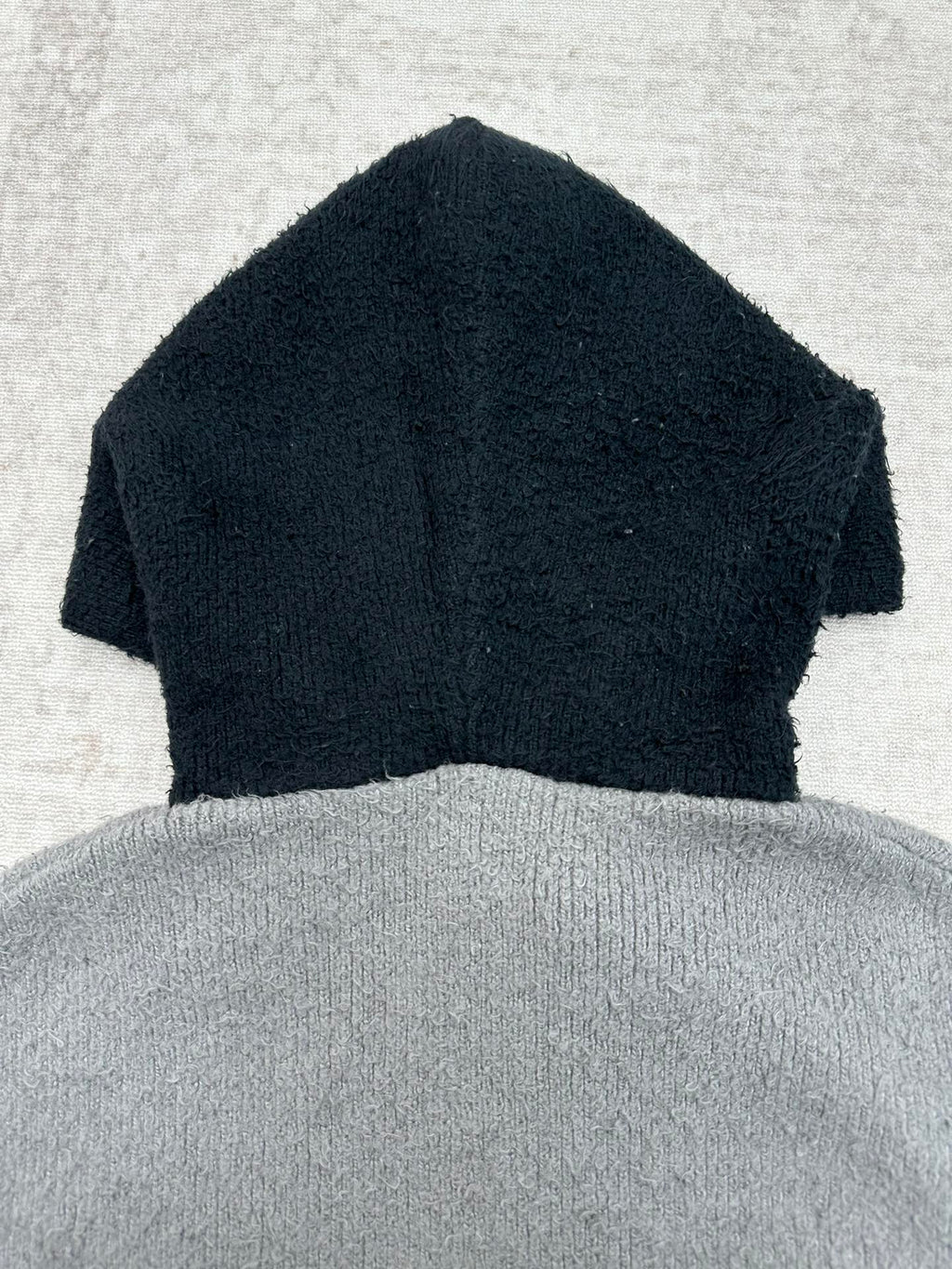 Balenciaga knit hooded zip sweater with dark navy top and gray lower body