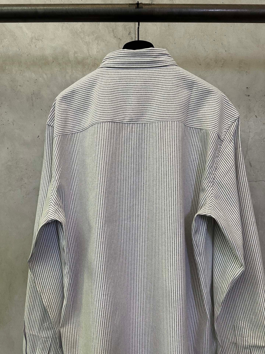 Striped long-sleeve button-up shirt back view with collar and wide yoke seam