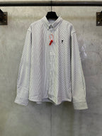 Striped button-up shirt with long sleeves, front buttons, and small chest logo embroidery