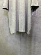 Heather gray T-shirt hem and lower back with small logo detail