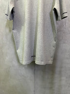 Heather gray T-shirt with small Chrome Hearts logo near back hem